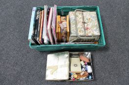 A box of books relating to needlework, quilt making and dressmaking, assorted knitting needles,