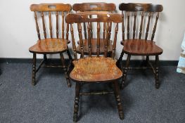 A set of four spindle back kitchen chairs