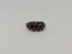 A 9ct gold amethyst and green tourmaline ring, size P CONDITION REPORT: 2.1g.