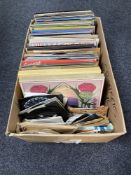 A box of a large quantity of LP's and 7" singles to include compilations, easy listening,