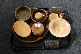 A tray of treen, polished turned wooden apple,