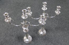 A pair of early 20th century silver plated three way table candelabra