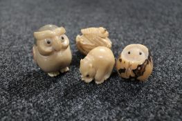 Four Japanese vegetable ivory netsukes in the form of an owl,