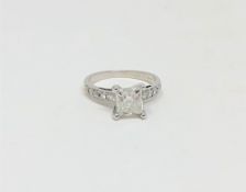 A 14ct white gold solitaire diamond ring, the princess-cut stone weighing approximately 1.