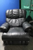 A black leather manual reclining Laz-y-Boy armchair