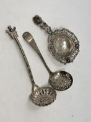 Three silver strainers