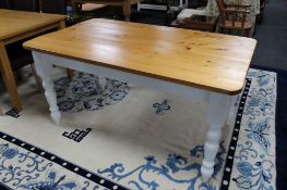 A pine farmhouse kitchen table on painted base