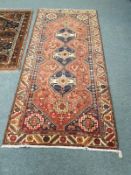 A Persian rug 130 cm x 278 cm