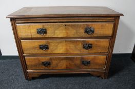 An Edwardian walnut three drawer chest