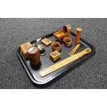 A tray of eleven antique tourist mauchlin treen pieces - thimble box, book holder, napkin rings,