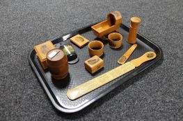 A tray of eleven antique tourist mauchlin treen pieces - thimble box, book holder, napkin rings,