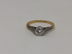 An 18ct gold solitaire diamond ring, the brilliant-cut stone weighing approximately 0.