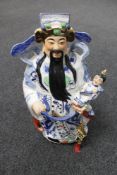 A Chinese pottery figure