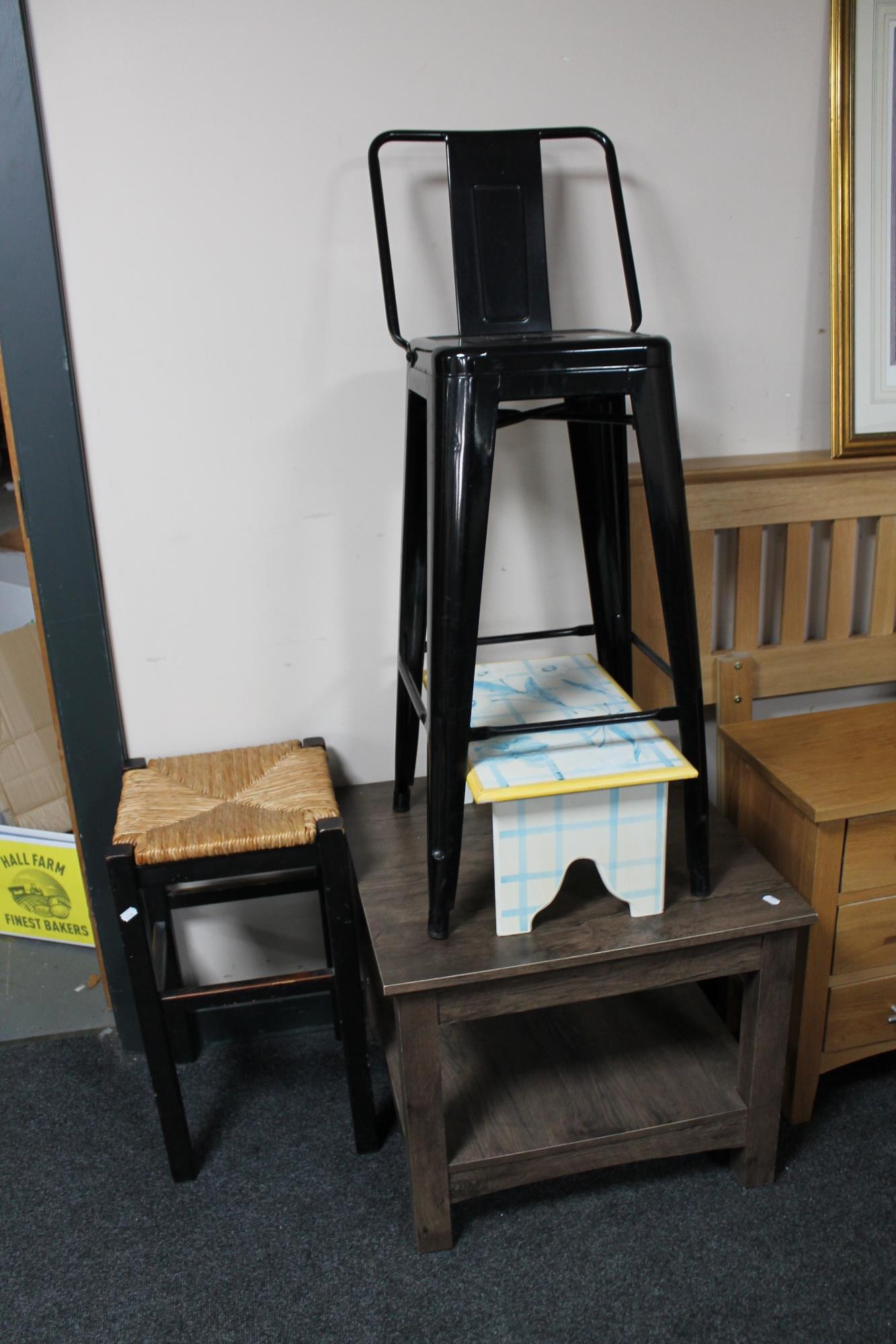 A metal french style bar stool together with a rush seated stool,