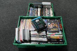 Two plastic rates of a large quantity of DVD's and blue rays including box sets