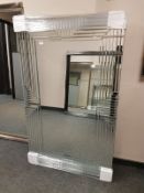 An all glass framed contemporary mirror