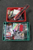 Two crates of mobile phone cases, note pads,