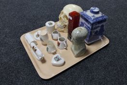 A tray of nine pieces of early 20th century crested china, resin skull, phrenology head,