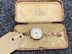 A lady's 9ct gold wristwatch retailed by James Walker of London,