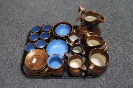 A tray of copper lustre tea service and six antique copper lustre jugs