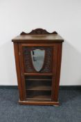 An Edwardian mahogany music cabinet