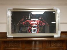 A framed print of Paul Pogba in red