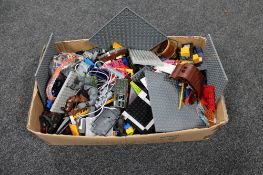 A box of assorted plastic building blocks