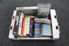 A box of books, CD's, magazines and a John Lennon New York Years action figure,