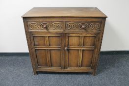 An oak double door dresser base