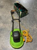 A boxed Bosch electric chain saw (no chain) and a Challenge lawn mower