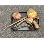 A tray of four antique copper and brass chestnut roasters and three drinks measures