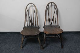 A pair of antique spindle back kitchen chairs