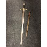 A replica Robin Hood Earl of Huntington sword together with another ornamental sword