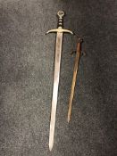 A replica Robin Hood Earl of Huntington sword together with another ornamental sword