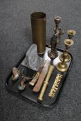 A tray of brass ammunition shell, brass candlesticks, pestle, bookends,