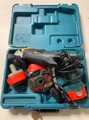 A cased Makita 12 volt electric drill with three batteries,