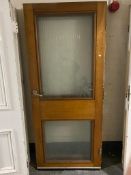 A painted pine interior door with frosted glass panels,