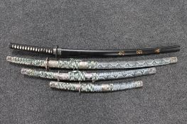 A set of three graduated Japanese style swords and a Japanese katana