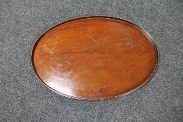 An oval Victorian mahogany serving tray