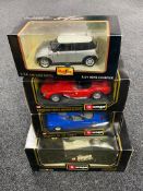 A boxed Burago 1:18 die cast vehicle Jaguar E Coupe together with three further boxed Maisto and