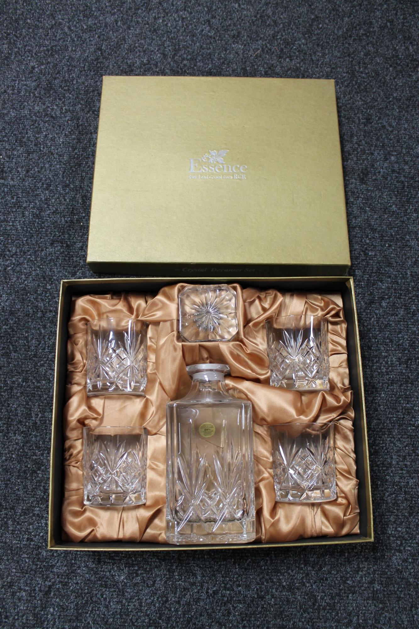 A boxed Essence RCM lead crystal whisky decanter and four glasses