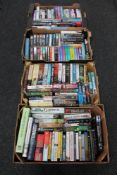 Four boxes of hardback and paperback books, novels including Andy McNab,