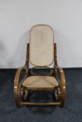 A Bentwood style bergere seated rocking chair