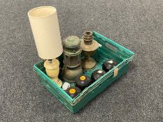A box of three vintage lawn bowls, paraffin tilly lamp, brass oil lamp base,