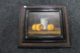 A framed 20th century continental school still life oil on canvas depicting a tankard with fruit