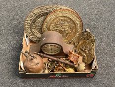 A box of copper and brass embossed plaques and trays, 1930's oak cased mantel clock,