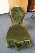 A Victorian mahogany framed lady's chair upholstered in a green button dralon
