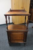 An Edwardian mahogany cabinet fitted shelf above,