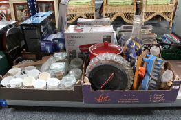 A box of assorted tea china, glass kitchen storage jars, glass bottle of shotgun cartridges,