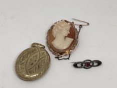 A gold cameo brooch,